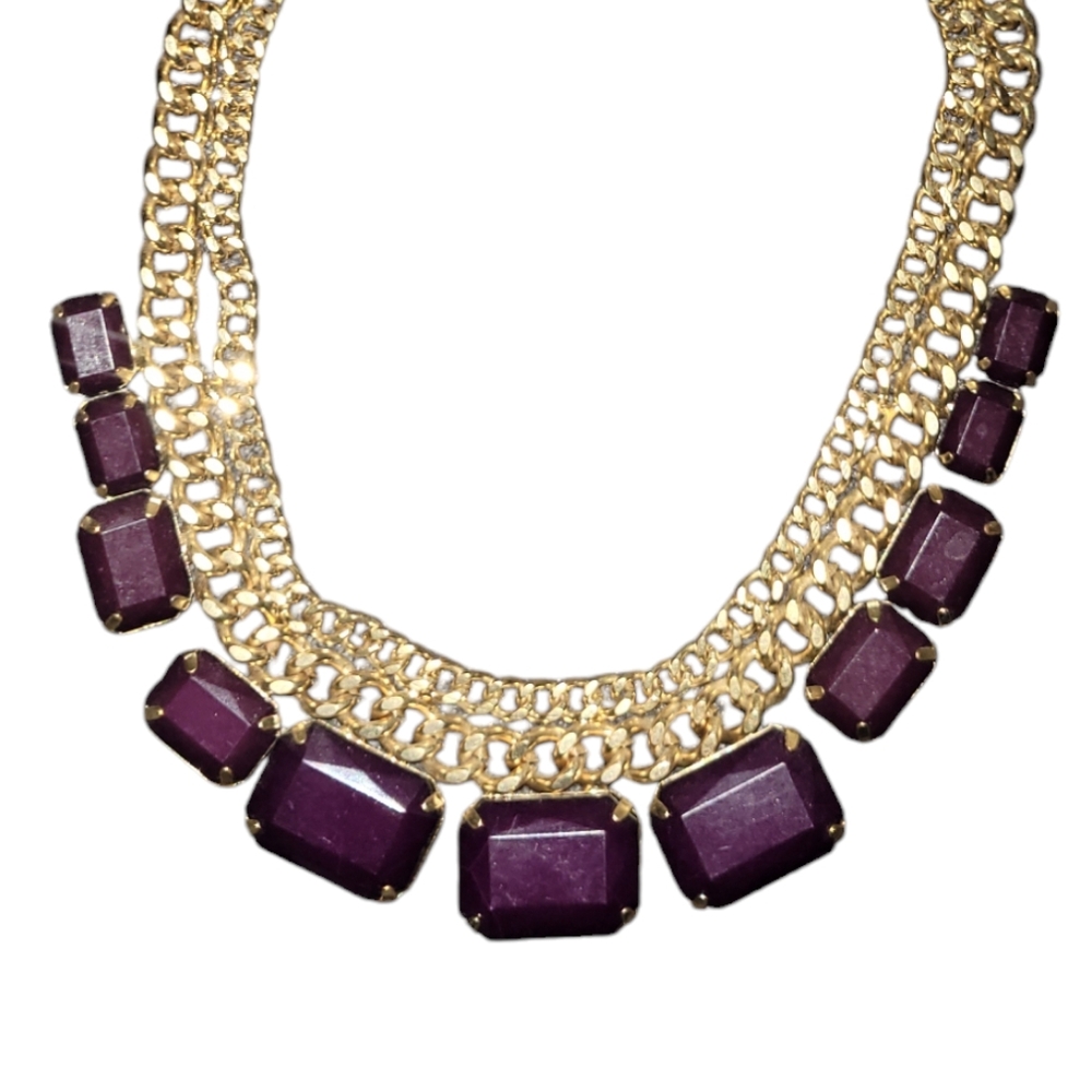 Gold-plated dual chain necklace with purple gem-like stones and adjustable clasp